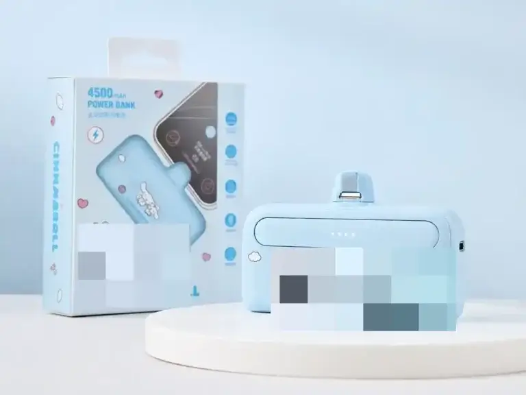 F69 blue direct-plug power bank and retail packaging with brand artwork obscured