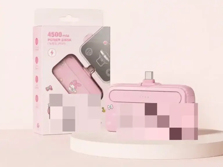 F69 pink direct-plug power bank and retail packaging with brand artwork obscured